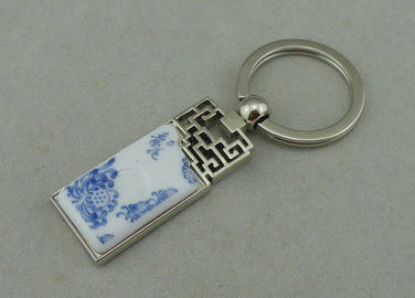 De Legering die van het 1.5 Duimzink Keychains met Opgenomen Porseleinstuk adverteren