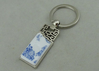 De Legering die van het 1.5 Duimzink Keychains met Opgenomen Porseleinstuk adverteren
