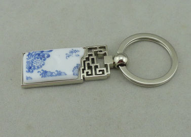 De Legering die van het 1.5 Duimzink Keychains met Opgenomen Porseleinstuk adverteren