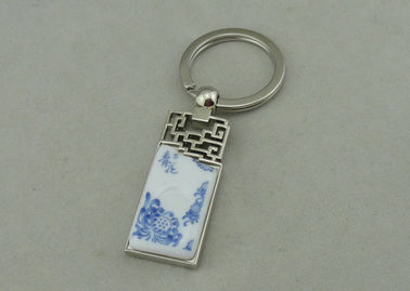 De Legering die van het 1.5 Duimzink Keychains met Opgenomen Porseleinstuk adverteren